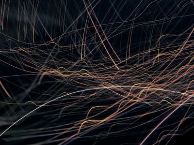 Abstract image of light trails suggesting movement and energy.